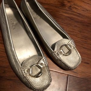 Woman’s gold flats